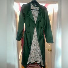 Never Worn Green Trench Coat Jacket With A Vintage Floral Print On The Inside. This Jacket Has A Little Something Extra Because It Flairs Out At The Bottom. There’s A Small Snag On The Back Of The Jacket, Pictured. Tag Says 3xl Uk 20, Which Should Be Us 16. Green Fitted Long Coat, Spring Green Outerwear With Lapel Collar, Green Lapel Collar Outerwear For Spring, Should Be Us, Green Trench Coat, Wear Green, Vintage Floral Print, Vintage Floral, Size 16