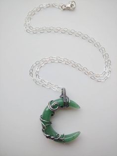 "This beautiful crescent moon shaped Green Aventurine stone is wrapped inside Sterling silver wire. Liver of sulphur has been used to give the silver an antique look, and it's sealed with Renaissance Wax to avoid tarnishing. The necklace has been made at 18\" on a Sterling silver chain, but length can be adjusted to fit your personal taste. The pendant hangs 1.5\" from chain. Finished with a lobster clasp. All my jewelry is handmade, and made with patience, care and love. In the unlikely event t Green Crescent Moon Charm Jewelry, Spiritual Crescent Wire Wrapped Necklaces, Handmade Green Crescent Jewelry, Black Obsidian Ring, Green Aventurine Necklace, Green Aventurine Stone, Obsidian Ring, Aventurine Necklace, Raw Quartz Crystal