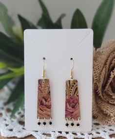 These raw brass earrings sound absolutely enchanting! The floral design gives them that perfect boho vibe, and the solid brass back adds a lovely contrast. The matching set of beads is such a charming detail, making them truly unique. Using repurposed materials with a decoupage technique adds an artistic touch that makes each pair special. They're not just accessories; they're little works of art! Fall Roses, Decoupage Jewelry, Roses Gift, Earrings Fall, Rose Gift, Brass Earrings, Boho Floral, Raw Brass, Works Of Art