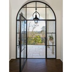 iron french double door with round transom and clear glass Peacock Pavers, Southern Houses, Minimalist Entryway, Coastal Mediterranean, Exterior Windows, Steel Frame Doors, Arch Door, Steel French Doors, Iron Front Door