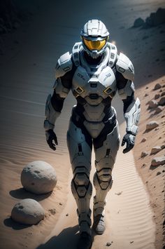 a man in a futuristic suit walking through the desert with rocks and sand behind him