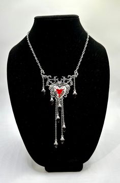 Dripping Heart & Skull Necklace. Silver, gothic bleeding heart necklace. Adjustable clasp. Red beads drip down the sides and bottom of the heart. Fun accessory for your Halloween costumes. Dripping Heart, Rhinestone Football, Wine Purse, Heart Skull, Halloween Skeleton Hand, Glitter Purse, Y2k Necklace, Y2k Jewelry, Gothic Necklace