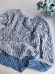 "The Light Blue Denim Ice Silver Double-Sided Mohair Sweater. Hand- knitted 100%. Let's favor elegance with a fluid and comfortable mohair sweater. This light mohair double-sided sweater by Knitalina is perfect for various outfit combinations and styles. Knitted cables give it style and versatility. The light material give it a nice, comfortable, airy feeling. It has length sleeves and a round neck and it's simple but playful at the same time. Size S-M: Width: approx. 48cm/19' Length: 52cm/21' S Blue Chunky Knit Casual Knitting Pattern, Blue Cable Knit Sweater For Layering, Blue Chunky Knit Sweater For Layering, Casual Blue Knitting Pattern, Blue Long Sleeve Knitting Pattern, Blue Hand Knitted Sweater, Blue Hand-knitted Sweater, Knitted Cables, Knit Mohair Sweater