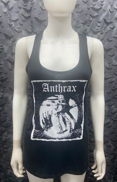 This is a black with white ink sleeveless long Anthrax tank top with racer back. This has a Anthrax image screen printed on the front. 60% cotton/ 40% polyester These are handmade screenprinted and slightly vary from the photo. Please feel free to email me any questions. Thanks for looking. Due to an influx of incorrect addresses if a package is returned, you must pay the shipping cost to resend the item to you. I do not do exchanges and I do not take returns unless the item is damaged. I thorou Fitted Sleeveless Grunge T-shirt, Fitted Gothic Tank Top For Streetwear, Black Gothic Tank Top For Streetwear, Edgy Skull Print Sleeveless Tank Top, Gothic Tank Top For Summer Concerts, Gothic Sleeveless Tank Top For Alternative Fashion, Sleeveless Stretch Top With Skull Print, Fitted Grunge Tank Top With Graphic Print, Stretch Sleeveless Top With Skull Print