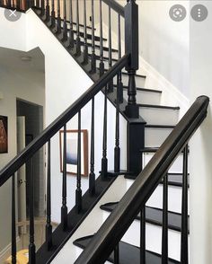 there is a black and white staircase in the house