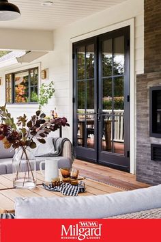 a living room filled with furniture and a fire place