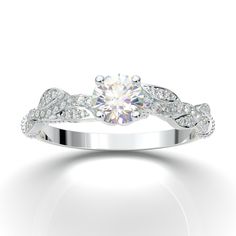 "White Gold Vintage Floral Engagement Ring from AurosiJewelsCouture TRY BEFORE YOU BUY! With our exclusive at home try on service. Learn more here: https://www.etsy.com/listing/964611062/home-try-on-engagement-ring-wedding-band?ref=shop_home_active_1&frs=1&crt=1 This intricate and elegant art deco, floral style engagement ring from Aurosi Jewels is an absolute stunner sure to make her and rest of the crowd say WOW!! With floral leaf motifs and art deco milgrain and filigree design, the genuine diamonds in the top and the band of this ring make this a timeless engagement ring. The milgrain etching and filigree on the inside of the ring allow this ring to radiate from all angles. The unique round cut crown head is perfect to hold either a CZ center, Forever One Moissanite DEF Colorless cente Oval Halo Ring, Deco Wedding Ring, Art Deco Wedding Ring, Wedding Ring Vintage, Milgrain Ring, Timeless Engagement Ring, Rose Gold Halo, Twig Ring, Floral Engagement Ring