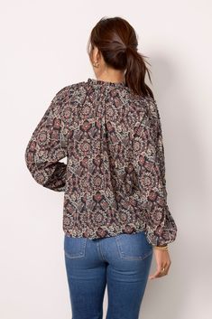 Finished in printed ikat fabric, this beautiful EVEREVE blouse will instantly elevate your wardrobe. The Kylie top features a split tie neckline with ties and long puff sleeves with a ruffle detail. | EVEREVE Women's Kylie Ikat Blouse, Size XL, Blue Patterned Ikat Print Long Sleeve Tops, Spring Ikat Print Long Sleeve Tops, Patterned Long Sleeve Boho Print Blouse, Spring Long Sleeve Ikat Print Tops, Casual Blouse With Blouson Sleeves And Tie Neck, Casual Tops With Blouson Sleeves And Tie Neck, Chic Long Sleeve Puff Top With Floral Print, Chic Long Sleeve Blouse With Boho Print, Fall Floral Print Long Sleeve Puff Sleeve Top