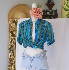 90s kinda love, We love a good staple, that is simultaneously unique. This super cute 1980s to 1990s vintage button down has the quality pure 100% silk material we seek & boho chic vibes we adore. A perfectly transitional blouse that will look cute with so many things: vintage denim, leather & trousers, as well as a perfect layering piece underneath cardigans & jackets. Wear set free, tied into a crop top or tucked within. Adorn this babe as you please ♻️ Condition: Very Good Color: Bohemian Blue Shirt For Vacation, Bohemian Button-up Tops For Vacation, Bohemian Button-up Beach Tops, Vintage Beach Shirt For Spring, Bohemian Fitted Summer Shirt, Fitted Bohemian Shirt For Beach, Vintage Short Sleeve Blouse For Vacation, Hippie Blue Tops With Boho Print, Blue Bohemian Button-up Shirt