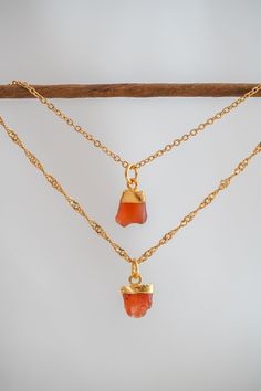 Raw Carnelian Necklace, Gemstone Necklace, Carnelian Necklace, Carnelian Pendant, Crystal Necklace, Carnelian Charm, Chakra Necklace Gold CARNELIAN PENDANT DETAILS - 18K gold plated brass or silver plated brass *Please note that, because these are natural stones, each gemstone varies in size, color, and shape. GOLD CHAIN DETAILS - All chains are 18k gold plated over stainless steel - Cuban chain length is approx. 17''  - Box chain length is approx 17.'' - Paperclip chain length is approx. 16.5'' Orange Agate Gemstone Necklace, Orange Carnelian Gemstone Necklace, Orange Pendant Necklace With Birthstone, Orange Birthstone Pendant Necklace, Orange Carnelian Necklace In Spiritual Style, Amber Carnelian Necklaces With Natural Stones, Orange Gemstone Pendant Necklace, Orange Agate Gemstone Crystal Necklaces, Red Carnelian Gemstone Necklace