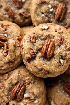 a pile of cookies with pecans on top