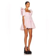 New Season Area Crystal-Trim Mini Dress Area Is Renowned For Combining Sparkling Embellishments With An ‘80s Manhattan Nightclub Aesthetic. True To The Label’s Approach, This Mini Dress Is Adorned With A Crystal Trim On The Sleeves, Adding A Radiant Finish To The Flared Piece. Imported Highlights Light Pink Cotton Sweetheart Neck Crystal Embellishment Cap Sleeves Rear Tie Fastening Rear Zip Fastening Flared Skirt Thigh-High Composition Outer: Cotton 100% Lining: Cotton 100% Washing Instructions Evening Mini Puff Sleeve Spring Dress, Evening Mini Puff Sleeve Dress For Spring, Spring Evening Puff Sleeve Mini Dress, Spring Evening Mini Puff Sleeve Dress, Pink A-line Puff Sleeve Dress For Summer, Pink Puff Sleeve Dress For Summer Party, Feminine Mini Puff Sleeve Dress For Summer, Puff Sleeve Dress For Spring Party, Summer Evening Puff Sleeve Mini Dress