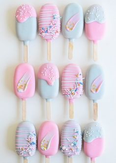 the cake pops are decorated in pastel colors