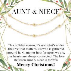 a christmas card with the words soul sisters on it and two gold balls hanging from chains