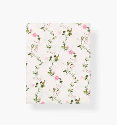 a white sheet with pink flowers on it