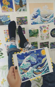 someone is holding up a piece of art that looks like the starry night over the ocean