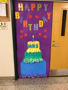 a purple door with a cake on it and the words happy birthday written on it