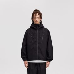 This casual yet avant-garde Modern Splash-Proof Raglan Windbreaker features an adjustable hood with belt loops to secure dangling hood strings. It boasts a brand logo embroidery on the left shoulder, splash-proof design, and adjustable cuffs and hem. The front and right arm have diagonal zip decorations, and the hood has a drawstring at the back. Made from premium 135 gsm fabric, it's slightly oversized, perfect for a contemporary, sporty look. Splash-proof design with brand logo embroidery Adju Modern Hooded Jacket With Detachable Hood For Streetwear, Spring Techwear Black Parka, Spring Black Techwear Parka, Techwear Outerwear With Drawstring For Streetwear, Urban Windbreaker With Drawstring For Streetwear, Urban Style Windbreaker With Drawstring For Streetwear, Hooded Windbreaker With Drawstring For Streetwear, Functional Streetwear Outerwear With Drawstring, Urban Style Hooded Jacket For Urban Adventures