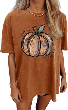 🎃 **Oversized Pumpkin Vibes 🎃   Get cozy in this **Pumpkin Graphic Tee perfect for Halloween and Thanksgiving 🍂. Whether you're sipping cider by the fire 🔥 or prepping for a spooky night out 👻, this oversized fit will keep you comfy and stylish!   ✨ **Why You'll Love It   - Soft, breathable fabric for all-day comfort 😍   - Cute pumpkin design 🎃 for the ultimate fall mood   - Perfect for layering on chilly autumn days 🍁   Add a dash of pumpkin spice to your wardrobe! 🎃👕 Oversized Brown T-shirt For Fall, Spooky Orange T-shirt For Fall, Oversized Soft-washed T-shirt For Fall, Fall Graphic Tee In Brown, Cute Oversized Fall Tops, Brown Graphic Tee For Fall, Cute Oversized Tops For Fall, Spooky Short Sleeve Tops For Fall, Orange Spooky T-shirt For Fall