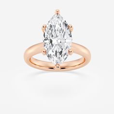 a rose gold ring with an oval cut diamond