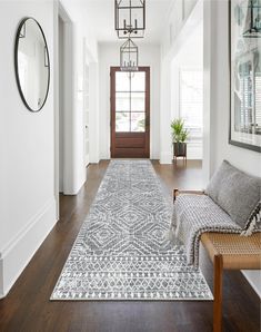 the hallway is clean and ready for us to use as an entrance way in this home