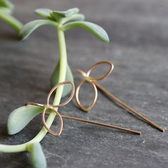 Sweet botanical earrings with a modern edge. These delicate petal threaders are subtle enough to wear everyday, with an interesting and somewhat unexpected design that you won't get tired of. 1/2" open petal shape dangles with fixed wire threader ear wire. Available in sterling silver, 14k gold fill (as shown), or mixed metal. All Rebecca Haas Jewelry is handcrafted by me in my Southern Vermont Studio from recycled and ethically sourced materials. Everyday Earrings Simple, Contemporary Handmade Jewelry, Threader Earrings Gold, Botanical Earrings, Metalsmithing Jewelry, Modern Botanical, Thread Earrings, Wrap Necklaces, Botanical Jewelry