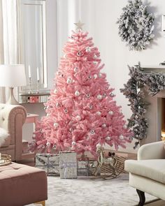 a pink christmas tree in a living room