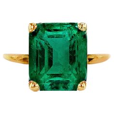 This ring is made of 18 karat yellow gold with natural emerald and sculptural detail. It belongs to Tea collection, which was featured in Vogue UA. It has a tiny tea twig on the side of the gem to have an unusual but still classy look of the ring, that perfectly fits to usual outfits, yet works for an evening black tie occasions. The ring is easy to wear, and the gem catches eye's attention with its beautiful neon colour. The gem has inclusions. Please specify the size for the ring. Do not hesitate to ask the artist, how this ring will work for you visually. The ring can be ordered with sapphire, paraiba tourmaline, malaya garnet, red or green tourmaline, spinel or diamond. For emerald or octagon cut we use sharp prongs, and more round prongs for a cushion cut. For the oval cut gems we use Classic Gold Ring With Tsavorite, Classic Yellow Gold Tsavorite Emerald Ring, Classic Yellow Gold Tsavorite Ring, Gold Tsavorite Emerald Ring For Formal Occasions, Formal Gold Emerald Ring With Tsavorite, Heirloom Emerald Ring In Yellow Gold, Formal Yellow Gold Emerald Birthstone Ring, Fine Jewelry Yellow Gold Emerald Ring For May Birthstone, Fine Jewelry Yellow Gold Solitaire Emerald Ring