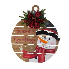 a wooden ornament with a snowman on it that says season's greeting