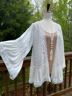 White lace cardigan, Stevie nicks style, bohemian, brand new, plus size, one size, white lace kimono, white lace cardigan, Great style for all body types. Layer with shorts, strapless dress or for a beach cover up Sizing: Standard womens U.S. sizing  Small 4-6 Medium 8-10 Large 12-14 Xlarge 16-18 2x 20-22 3x 24-26 Non-stretch Bohemian V-neck Cardigan, Non-stretch V-neck Bohemian Cardigan, White Long Sleeve Cardigan For Beach Cover-up, Bohemian Fitted V-neck Outerwear, White Long Sleeve Outerwear With Lace Trim, White Lace Trim Outerwear For Fall, Oversized White Summer Outerwear, One Size Bohemian Outerwear For Summer, One-size Fall Cardigan As Beach Cover-up