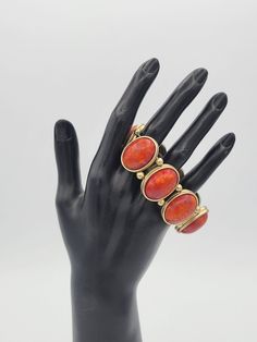 "Vintage Gold Tone & Faux Red Coral Cabochon Beaded Stretch Bracelet Costume This chunky bracelet has a great bohemian look.  The bracelet is made up of brushed gold-tone oval settings & beads that are strung on 2 elastic bands.  The bands have almost no stretch.  Inside the settings are large faux red coral cabochons.  This bracelet is in excellent, nearly new condition.   Dimensions: 7\" long, 1 1/8\" wide Clasp: Stretch Markings: None Condition: Excellent - nearly new All of my shop items are pre-owned vintage.  All pieces should be expected to have some vintage wear unless otherwise stated.   Great for the vintage & costume jewelry lover!  Be sure to check out our other vintage jewelry listings! Looking for something that isn't listed in my shop? Send me a message! I have thousands of Red Metal Cuff Bracelet Bangle, Red Metal Cuff Bracelet, Red Metal Beaded Bracelet With Round Beads, Red Metal Bangle Cuff Bracelet, Red Adjustable Metal Cuff Bracelet, Adjustable Red Metal Cuff Bracelet, Red Bohemian Stretch Bangle Bracelet, Red Bohemian Bangle Stretch Bracelet, Red Vintage Adjustable Cuff Bracelet