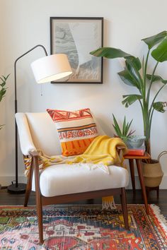 a living room with a chair, rug and potted plants on the side table