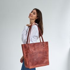 "Genuine leather minimalist messenger bag for women. Zipper closure and shoulder straps.  DIMENSIONS: Size S 29.2 x 33 x 25.4 cm 11.5 x 13 x 10\"\" Size M 30.4 x 38 x 26.6 cm 12 x 15 x 10.5\"\" Size L 30.4 x 45.7 x 27.9 cm 12 x 18 x 11\"\" Size XL 33 x 53.3 x 34.2 cm 13 x 21 x 13.5'' Length of shoulder straps - 27.9 cm / 11\" Eight colors are available. Your item may be personalized according to your wish. See the banners for more information." Minimalist Double Handle Shoulder Bag With Leather Lining, Minimalist Leather Shoulder Bag With Adjustable Strap, Minimalist Brown Business Bag, Minimalist Satchel Bag With Leather Lining, Minimalist Everyday Shoulder Bag With Leather Lining, Minimalist Brown Shoulder Bag For Travel, Everyday Minimalist Shoulder Bag With Leather Lining, Minimalist Leather-lined Shoulder Bag For Everyday, Minimalist Bags With Leather Lining