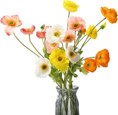 a vase filled with lots of different colored flowers