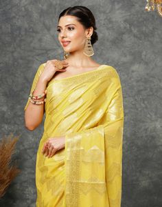 Yellow Woven Banarasi Georgette Saree  Yellow Woven Banarasi Georgette Saree is a luxurious and elegant piece. The intricate weaving patterns, often featuring floral motifs or geometric designs, create a rich and textured fabric. The georgette base adds a touch of softness and flowiness, making it comfortable to wear.  Features Of Yellow Woven Banarasi Georgette Saree  Traditional Handloom Craft  Intricate Gold Brocade Work  Durability and Longevity   Size Fit  The model height is 5.7 ft   WASH Brocade Pre-draped Saree For Diwali Puja, Gold Brocade Pre-draped Saree With Zari Weaving, Transitional Georgette Blouse Piece With Zari Weaving, Unstitched Gold Georgette Blouse Piece, Gold Brocade Saree With Unstitched Blouse, Gold Georgette Traditional Wear For Diwali, Unstitched Gold Georgette Saree, Gold Unstitched Georgette Saree, Gold Georgette Unstitched Saree