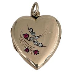 This is an Edwardian heart shape locket pendant crafted in 9K gold. Circa 1910. The piece depicts a swallow reaching for a branch. It features red and clear paste. There is a space for pictures inside. Weight: 5.12g Size: 3.2x2.2cm ——— If you have any questions, please feel free to ask. We describe our items accurately. Please note that in reality they can look much better because photo can’t capture that magical sparkle. We have many years of experience in this business. And we have a very care Luxury Heirloom Heart Pendant Necklace, Heart Shape Locket, Edwardian Necklace, David Webb, Big Diamond, Diamond Brooch, Fancy Dinner, Vintage Heart, Christian Lacroix