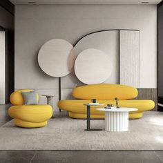 a living room filled with yellow furniture next to a white table and two round mirrors