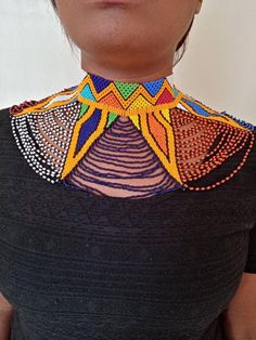 African wedding necklace, Zulu necklace, Beaded shawl necklace, African jewelry, Masai necklace, Bridesmaid necklace, Wedding giftThis stunning necklace is superbly crafted with fine beads.The necklace can be worn with any outfit at different occasions and it will absolutely makes you stand out.100% handmade using fine beads.Closure: ball jointColor: Multicolor3-5 days delivery via DHL Express***The shipping fee is for the first item only and additional necklaces or items ship for free.******BRO Multicolor Beaded Chain Necklace For Wedding, Multicolor Beaded Necklace For Wedding, Multicolor Handmade Choker For Wedding, White Beaded Choker For Festivals, Multicolor Beaded Choker For Wedding, Bohemian Beaded Necklaces With Large Beads For Weddings, Bohemian Beaded Necklaces For Wedding, Bohemian Beaded Necklaces With Round Beads For Wedding, Bohemian Beaded Necklace With Round Beads For Wedding