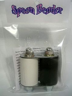 two black and white batteries in plastic packaging