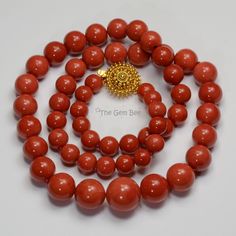 DESCRIPTION: Thank you for coming in! Spectacular 18K solid gold necklace with Mediterranean Sardinia Coral sphere beads, no dye, 100% natural tomato red color. 9.5mm-17.15mm large coral beads, 128 grams with a beautiful 18k solid gold clasp~Our favorite color for coral! The beads are premium quality, you do not find hairline cracks which are common with Mediterranean coral beads. Accompanied with GIA report number 2191866911 to assure your investment! You'll get the necklace you see! SIZE of co Formal Single Strand Red Coral Necklace, Formal Round Polished Beads Necklace, Formal Round Necklace With Polished Beads, Luxury Single Strand Round Beaded Necklace, Hand-strung Red Coral Jewelry For Gifts, Hand-strung Red Coral Jewelry As A Gift, Hand-strung Red Coral Jewelry Gift, Elegant Red Hand-strung Beaded Necklaces, Elegant Hand-strung Red Beaded Necklaces