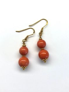 This pair of earrings are made with red sea bamboo beads and gold plated sterling silver. - Made with genuine sea bamboo beads and gold plated sterling silver beads, wire and hooks - Approximately 44 mm / 1.73 inches in length - Approximately 8 mm diameter of small sea bamboo bead and 10 mm diameter of big sea bamboo bead Visit my shop for more: http://www.etsy.com/ca/shop/RitaCollection If you have any questions regarding the item or my store in general, feel free to message me! Yellow Gold Round Bead Earrings As Gift, Yellow Gold Earrings With Round Beads As Gift, Red Hypoallergenic Round Bead Earrings, Coral Earrings With Ear Wire As Gift, Coral Earrings For Gift, Red Coral Earrings As Gift, Red Coral Drop Earrings, Gold Earrings With Polished Beads For Gift, Orange Round Bead Earrings For Gifts