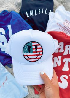 "The perfect hat for summer! Now you can purchase my most popular American Flag Smiley Patch already attached to a hat. ✳Size: one size fits most, with snaps to make it larger or smaller! ✳Color: White ✳Kind: Trucker hat ✳INCLUDES ONE HAT WITH PATCH ON IT IMPORTANT Once your order is shipped I am not responsible/liable for the package. The United States Postal Service is responsible for delivery. If there are any problems with the delivery or a missing package, please reach out to me and I will Fun Summer Baseball Cap With Curved Brim, Summer Streetwear Sun Hat With Curved Brim, Curved Brim Sun Hat For Summer Streetwear, Adjustable Sun Hat For Summer Streetwear, Casual Summer Snapback Baseball Cap, Adjustable Sun Hat For Streetwear In Summer, Cute Summer Baseball Cap, Casual Vacation Baseball Cap, Summer Streetwear Bucket Hat