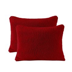 two red pillows sitting next to each other