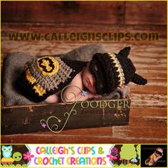 a newborn baby wearing a harry potter hat and diaper is laying on a wooden crate