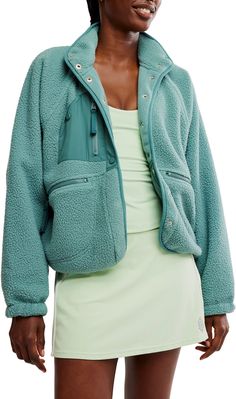 Perfect to layer over activewear or streetwear, this fleece jacket features a button-up front with cool zippered pocket details. Fit & Design: Easy, slouchy silhouette that hits right at the waist Fuzzy fleece, warm with room to layer underneath Nylon patches Zipper pockets Button-front closure Elastic cuffs Athleisure Half-zip Outerwear With Pockets, Fall Sports Fleece Jacket With Pockets, Hooded Fleece Jacket With Pockets For Athleisure, Hooded Fleece Jacket With Pockets Athleisure, Sporty Fleece Jacket With Pockets For Fall, Athleisure Sports Fleece Jacket With Pockets, Sporty Fleece Outerwear With Pockets, Athleisure Fleece Jacket For Outdoor Activities, Hit The Slopes Fleece Jacket