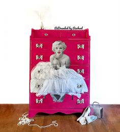 a pink dresser with an image of marilyn monroe on the top and white tulle skirt