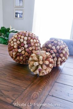 two wine corks sitting on top of a wooden table