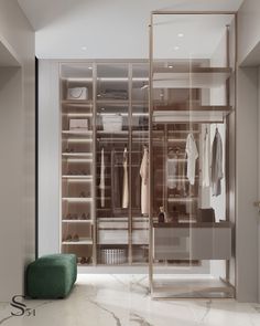 a walk in closet filled with lots of clothes and shoes next to a green ottoman