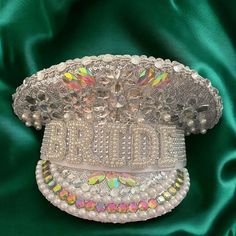 Are you ready to make a dazzling statement at your next event?  Introducing the Sequin Burning Silver Bride Military Hat, a unique accessory that combines the charm of a sailor captain's hat with the sparkle of sequins. Handcrafted with meticulous attention to detail, this hat is perfect for birthdays, festivals, or any occasion where you want to stand out. Available in a variety of colors, this hat is designed to elevate your outfit while showcasing your individuality. Features & Benefits - Handmade Craftsmanship     Each hat is carefully crafted by skilled artisans, ensuring a high-quality product that stands out. This attention to detail means you receive a unique piece that is both stylish and durable. - Sequin Burning Material     The shimmering sequins catch the light beautifully, ma Bachelorette Party Hat, Sequin Hat, Clothing Tape, Pearl Letters, Bride Hat, Bridal Hat, Bachelorette Party Bride, Festival Hat, Women Bride