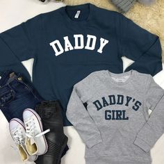 We can't even deal with the cuteness of these Daddy & Daddy's Girl father & daughter matching sweatshirts. ITEMS IN SET SOLD SEPARATELY - simply add sizes into cart separately using the drop down menu above.  Daddy & Daddy's Girl matching Classic styled sweatshirts Crew Neck College style text Ringspun cotton Wash at 30 Degrees Long Sleeve T-shirt With Letter Print For Father's Day, Father's Day Long Sleeve Letter Print T-shirt, Father's Day Long Sleeve T-shirt With Letter Print, Family Matching Graphic Print Sweatshirt, Family Matching Crew Neck Sweatshirt For Father's Day, Father's Day Casual Sweatshirt With Name Print, Father's Day Cotton Sweatshirt With Name Print, Family Matching Long Sleeve Sweatshirt With Name Print, Father's Day Family Matching Long Sleeve Tops